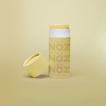 Load image into Gallery viewer, front angle eye level shot Nöz yellow color nose application sunscreen stick 
